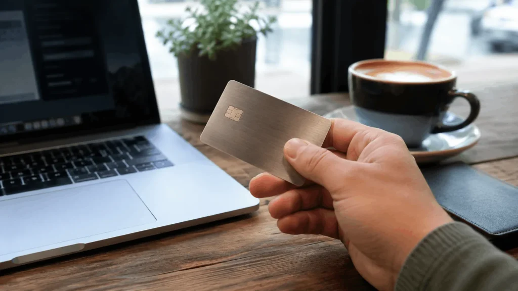 Best Metal Credit Cards Worth Carrying in 2026 1 best metal credit cards compared on a cafe table